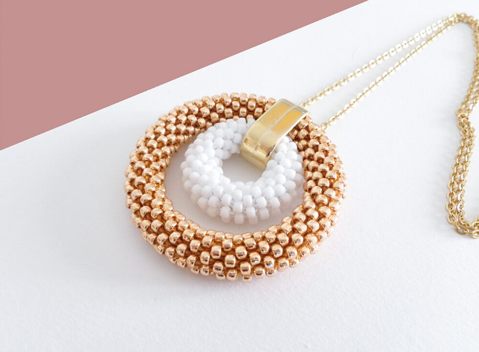 Collana con doppio ciondolo rotondo oro rosa e bianco, modello Bigger Donut