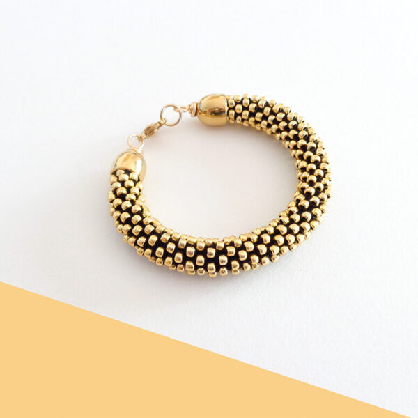 Bracciale color oro, modello "Snake"