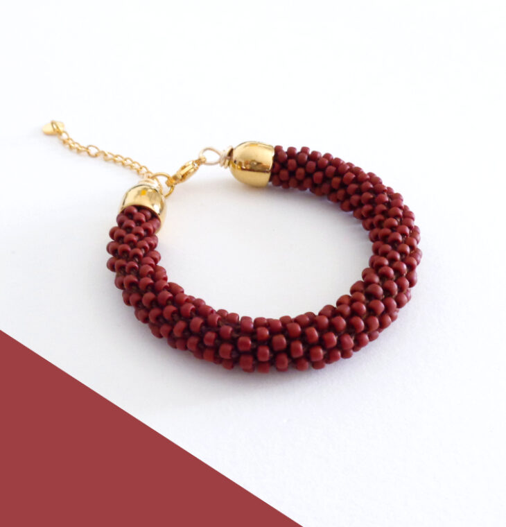 Bracciale tubolare rosso vino modello "Snake"
